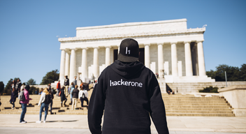 person with hackerone hoodie walking to lincoln memorial